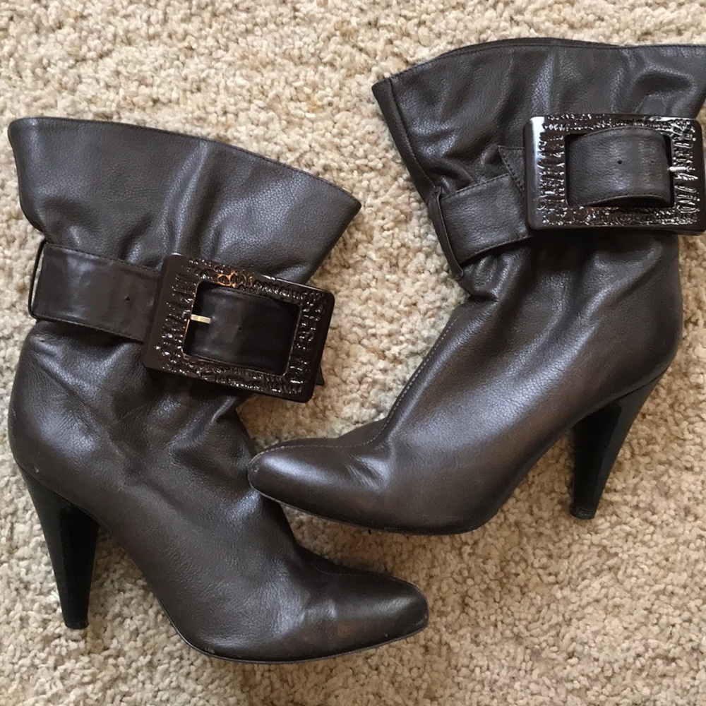 Brown leather high heel booties with buckle detail